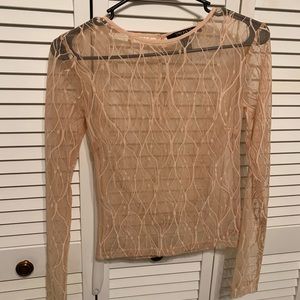 Cream colored see-through long sleeve top